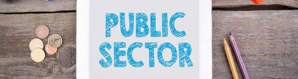 Public Sector. Tablet device on a wooden table